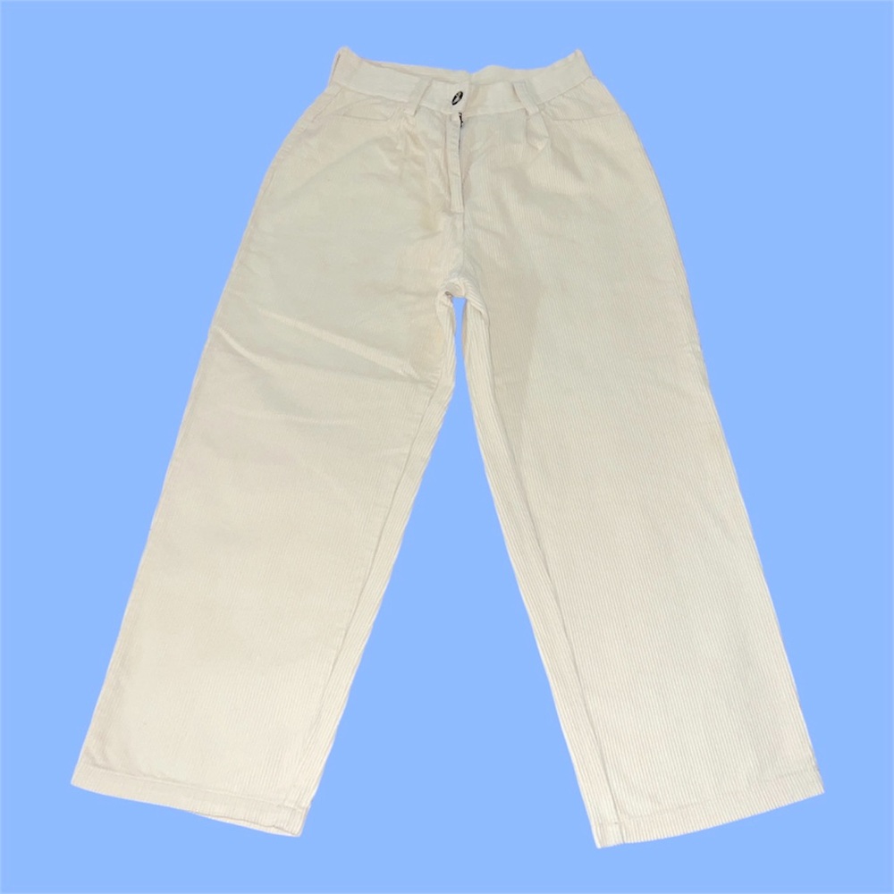 Cream high-waisted corduroy pants.